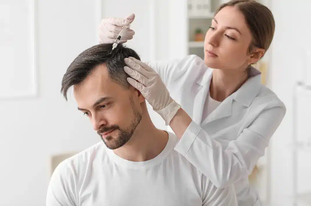 Patient receiving FUE hair transplant in Istanbul clinic – hair transplant cost in Turkey